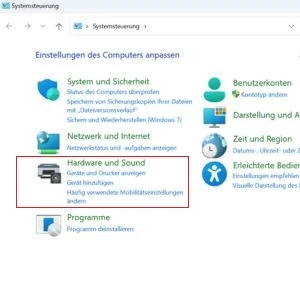 Systemsteuerung mit einem blauen Pfeil bei „Hardware und Sound“